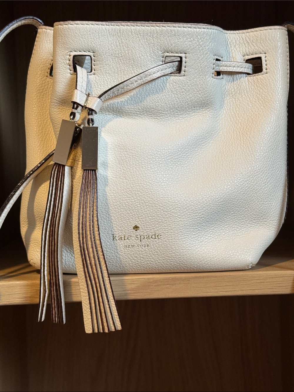 Kate Spade Cream Pebbled Leather Drawstring Crossbody with Tassel
